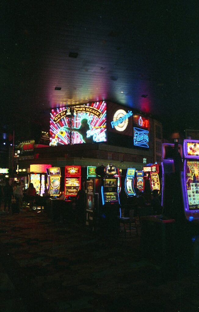 Dubibet Live Casino Entry | Login & Register Page Vibrant Las Vegas casino scene filled with colorful neon lights and slot machines at night.