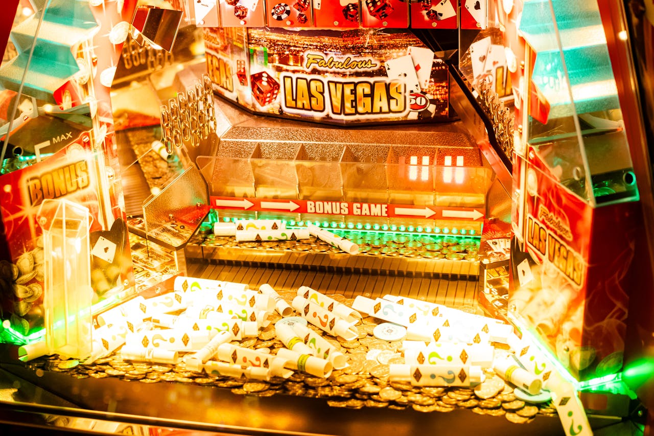 Dubibet Login & Register | Official Access for Members Colorful casino game machine featuring Las Vegas theme with coins and poker cards.